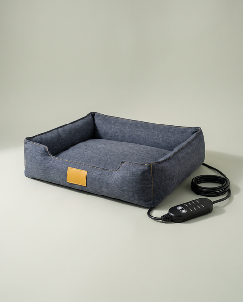Le Panier Chauffant, gris-bleu chiné, vu de trois quarts avec son boîtier de commande