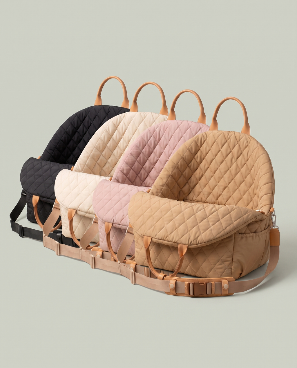 Les quatre coloris du Siège Auto alignés : noir, écru, rose poudré, camel